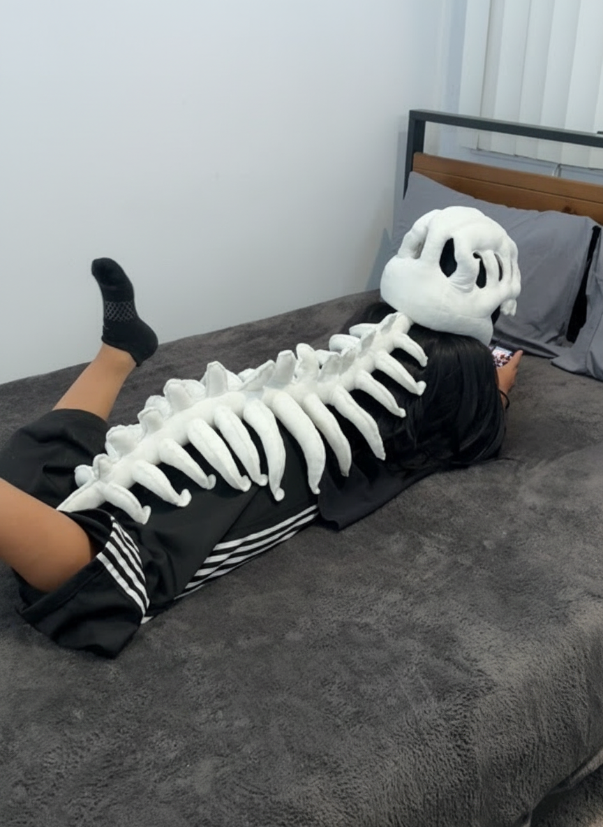 Peluche suave de dinosaurio esquelético DinoHuesitos, felpa ultra suave, vista lateral